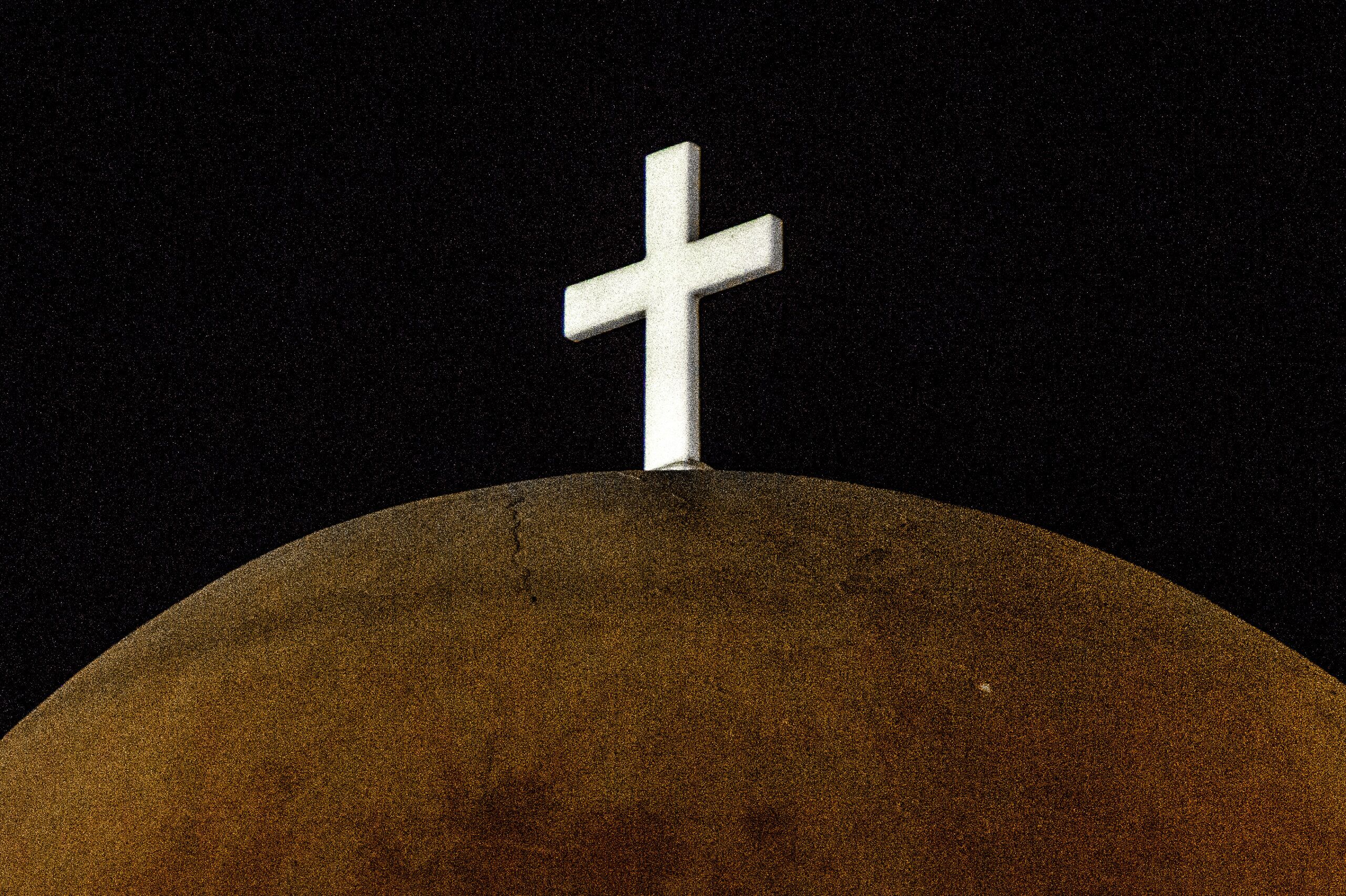 An image of the religious cross on a temple in Mykonos, Greece.